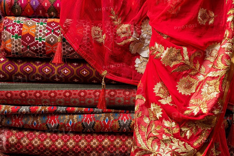 Bales of cloth and sartoids are offered for sale