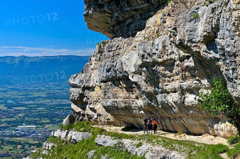 Narrow balcony path La Corraterie with panoramic view of the Geneva basin on the way to the summit Mont Saleve
