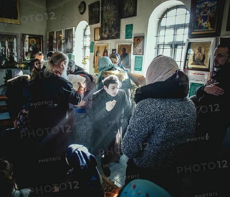 Father Sergei during an exorcism in his church in Ochamchira