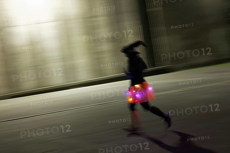 Costumed runner with witch hat