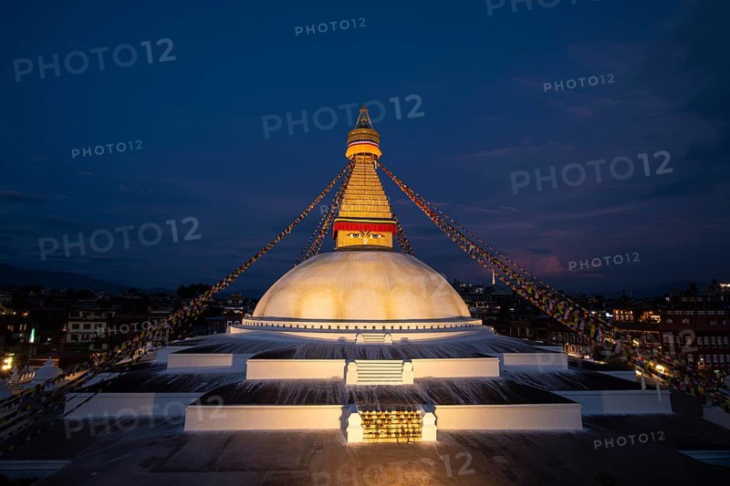 Boudha Stupa with the all-seeing eyes of Buddha in the evening light