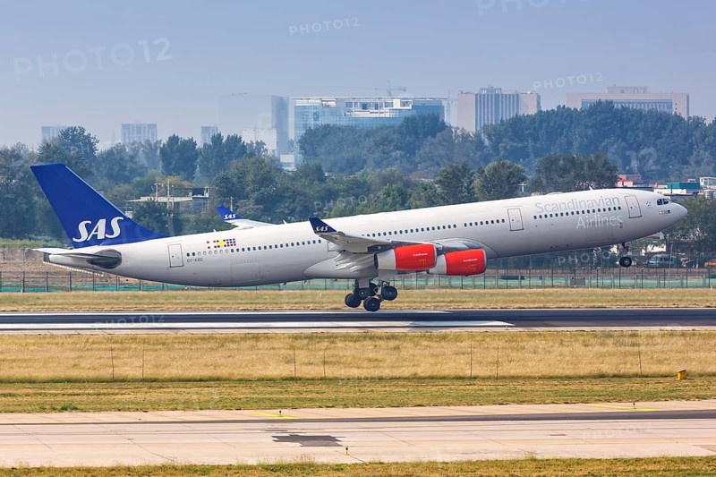 An Airbus A340-300 aircraft of SAS Scandinavian Airlines with registration OY-KBD at Beijing Airport