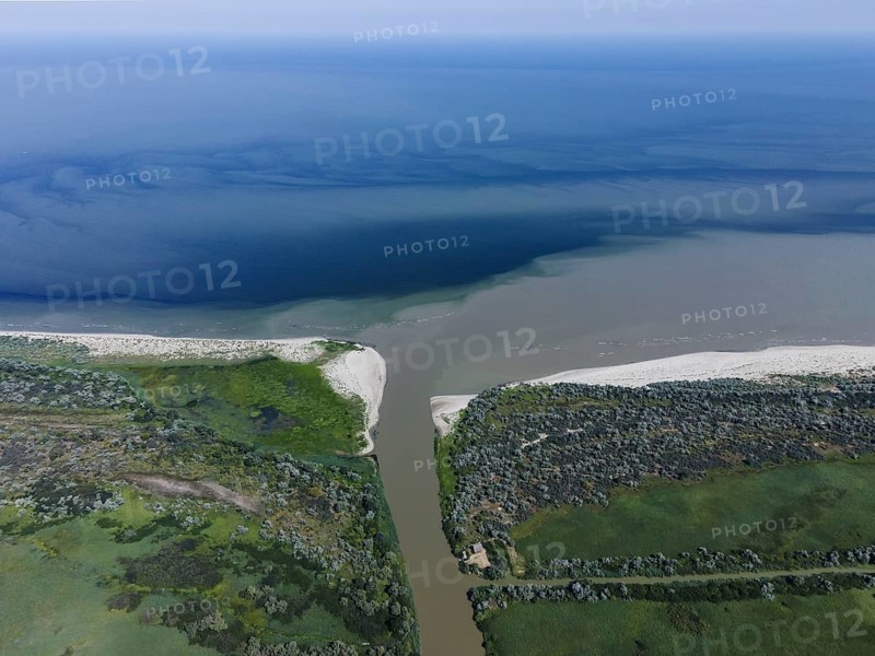 Aerial view on the distributary channel Danube river flowing into the Black Sea