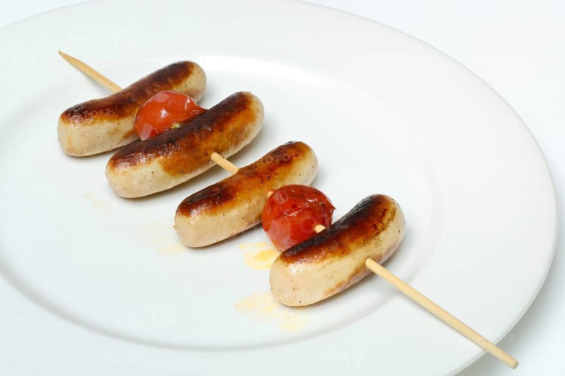 Chipolata sausages on wooden skewers