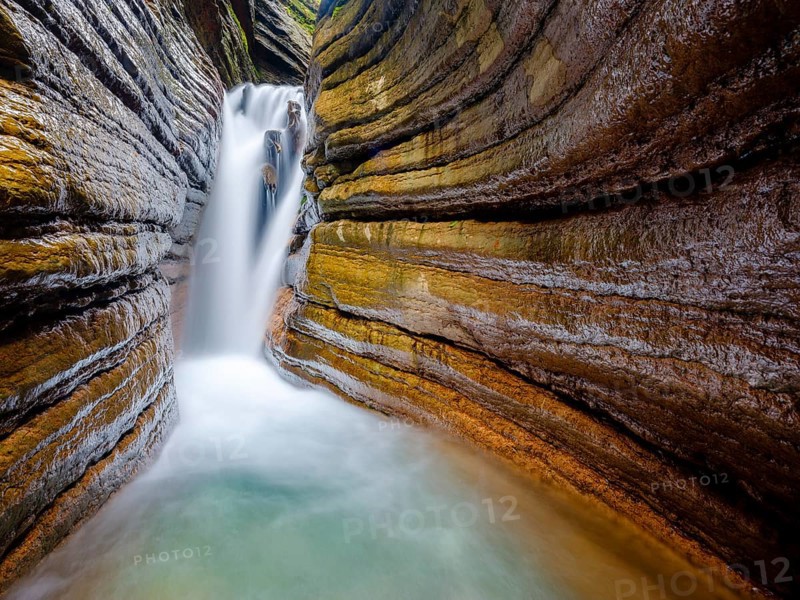 The Taugl or Tauglbach flows through the red gorge