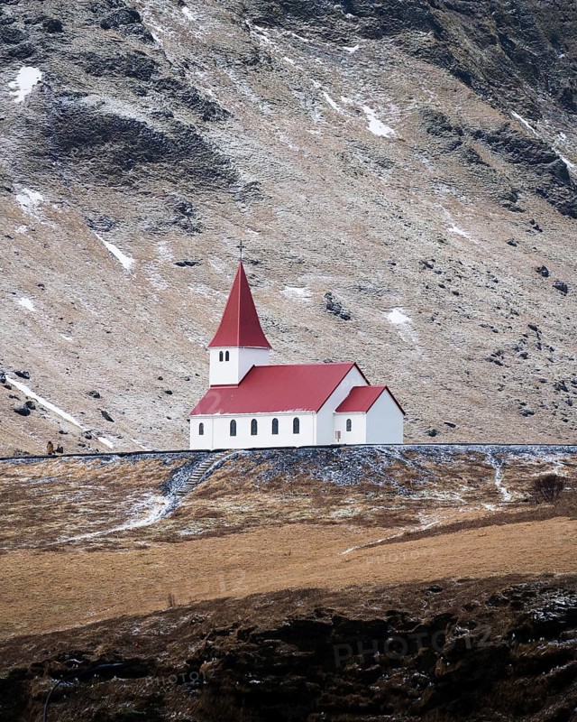 Small church with red roof in Vik from a distance