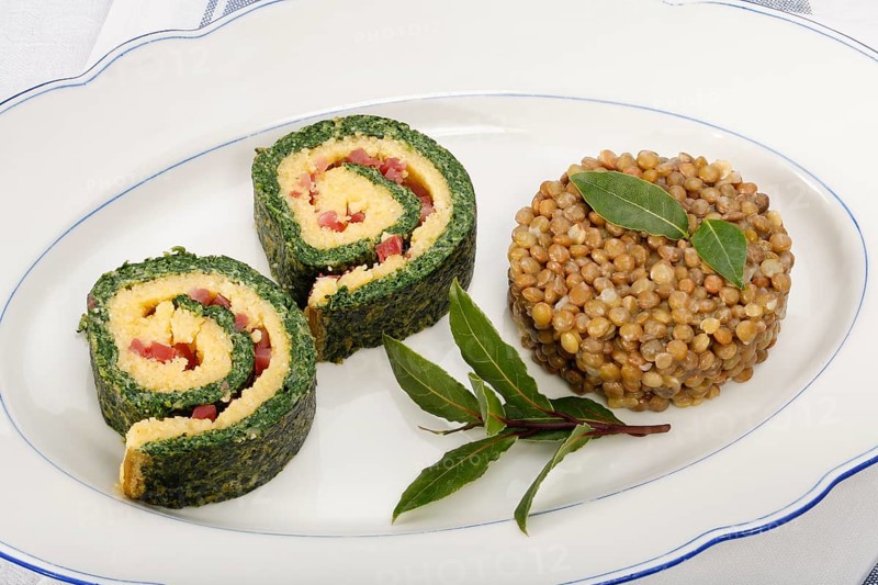 Polenta Spinach Roulade with Alblinsen arranged on a serving plate