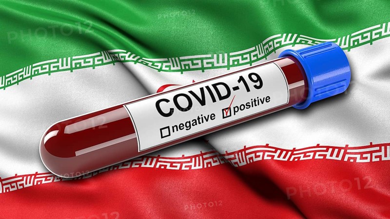 Flag of Iran waving in the wind with a positive Covid-19 blood test tube. 3D illustration