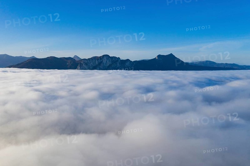 Dragon wall and sheds rising out of the sea of fog