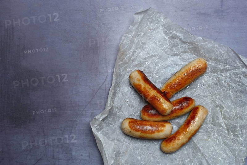 Several Chipolata sausages