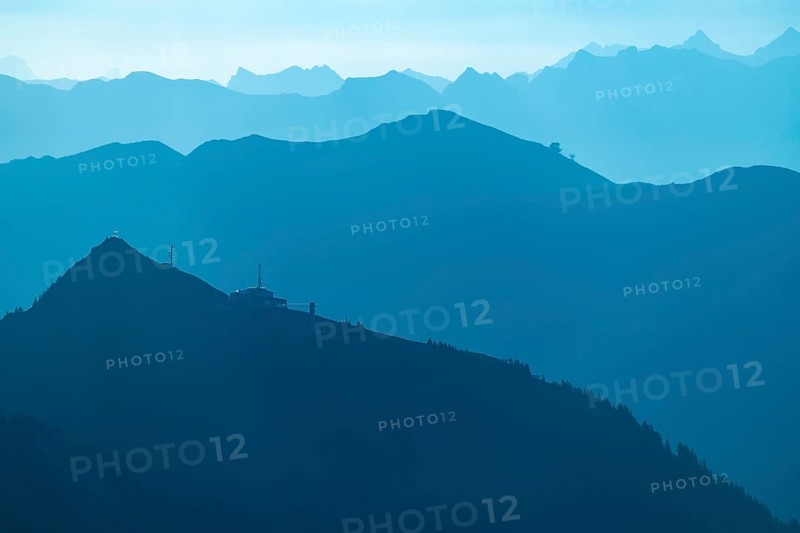 Summit station of the Diedamskopf Bahn at the blue hour with the Allgaeu Alps behind