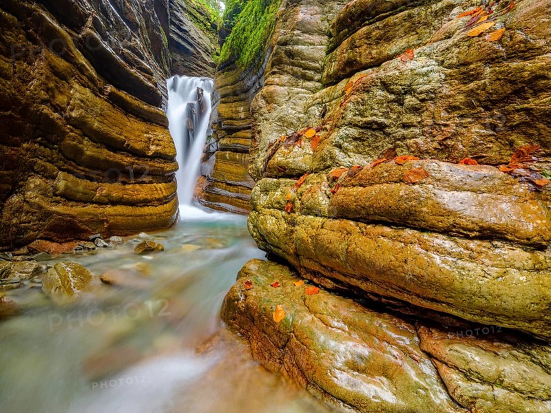 The Taugl or Tauglbach flows through the red gorge