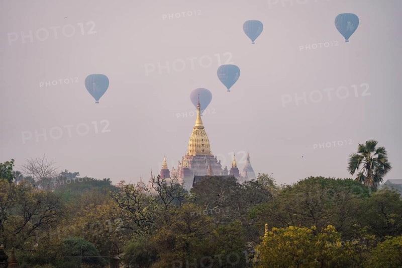 Ananda temple with several colorful balloons