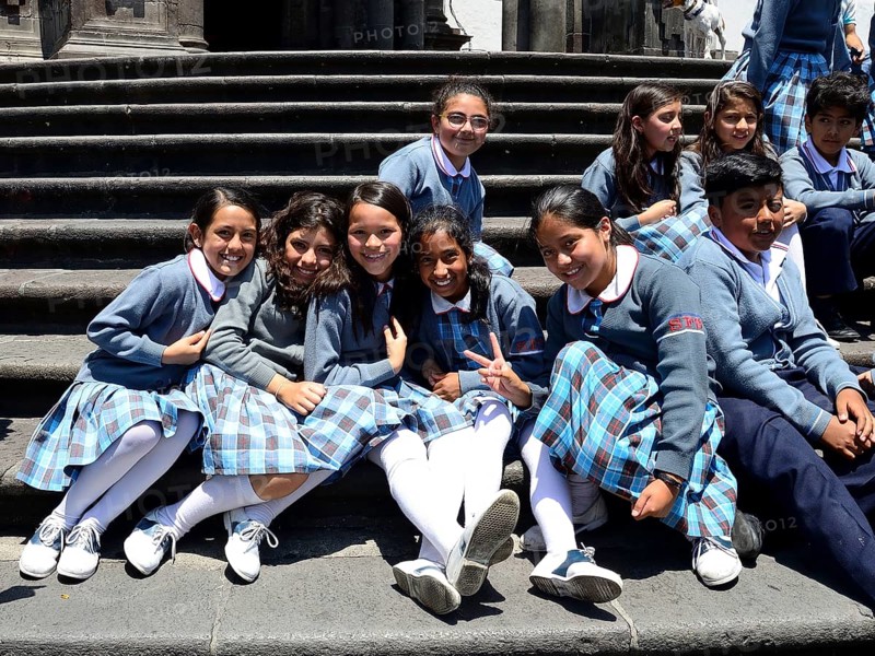Girls in school uniform on the steps of the cathedral