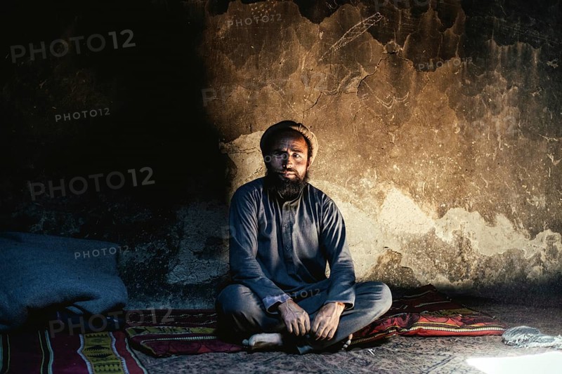 Man sitting on a carpet