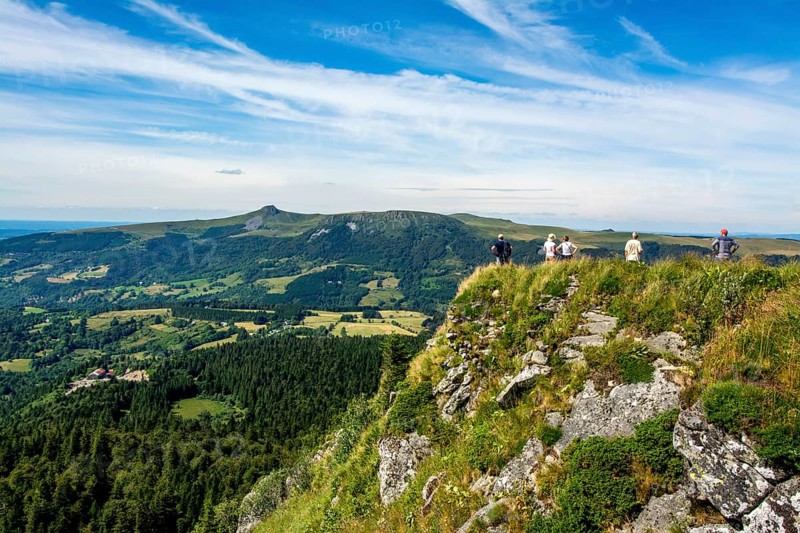 Walkers in the Sancy massif at back
