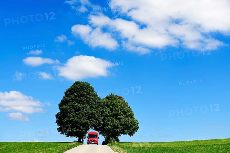 Motorhome on picture book country road near Berg