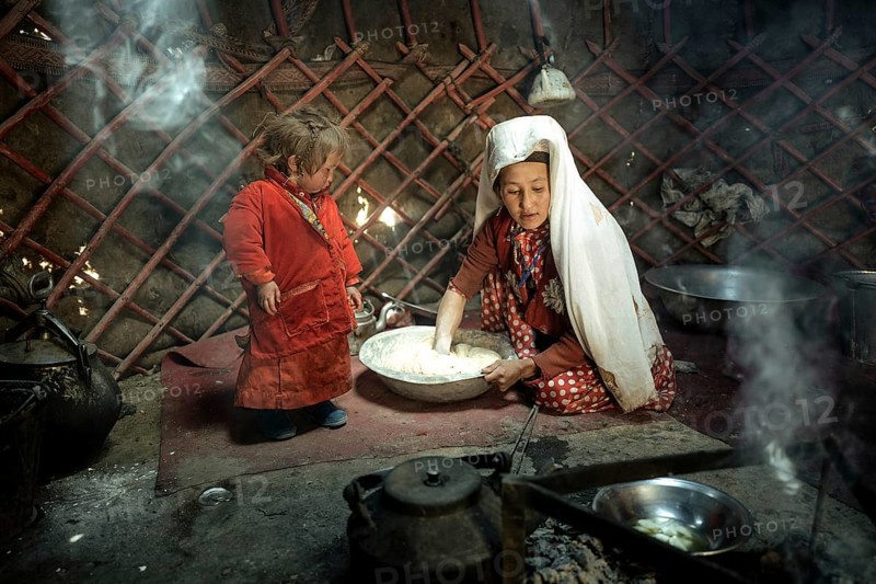 Woman and infant in traditional Kyrgyz traditional traditional traditional traditional traditional traditional traditional traditional traditional costume