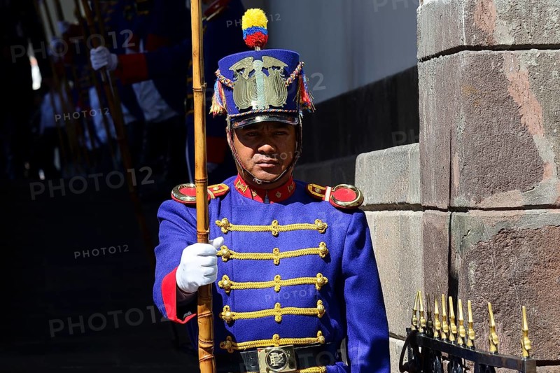 Guard in colourful uniform in front of the seat of government Palacio de Carondelet