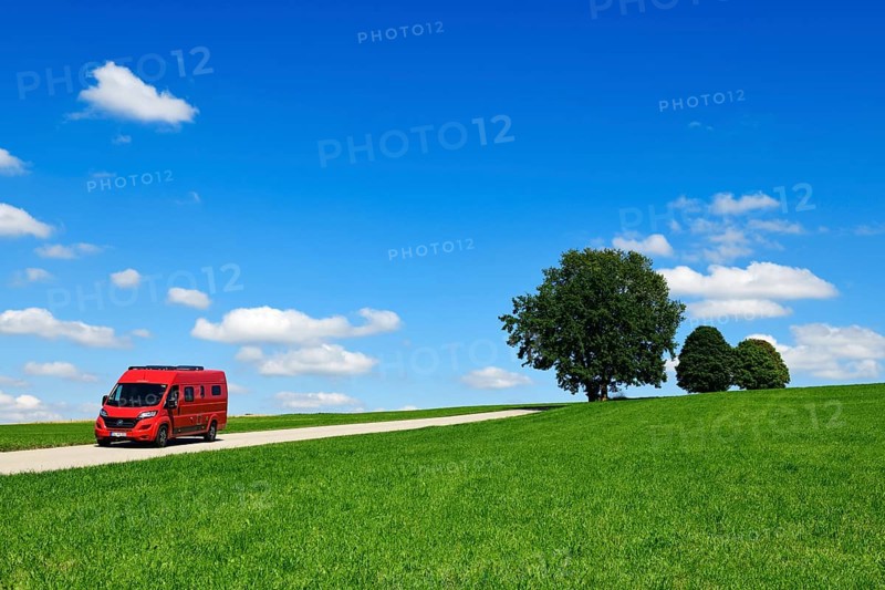 Motorhome on picture book country road near Berg