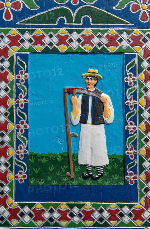 Portrait of a farmer on a grave cross in the Merry Cemetery