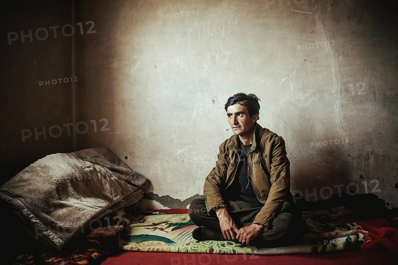 Man sitting on a blanket