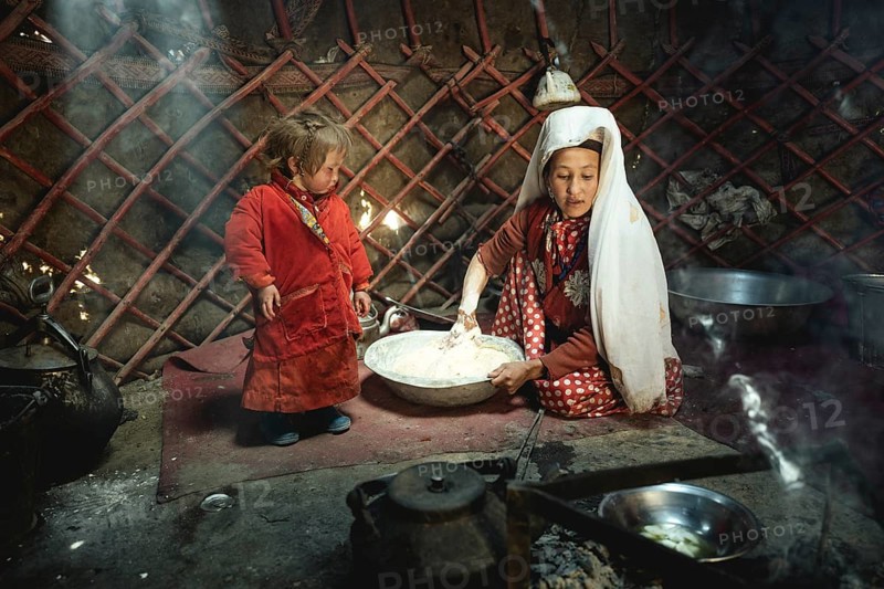 Woman and infant in traditional Kyrgyz traditional traditional traditional traditional traditional traditional traditional traditional traditional costume