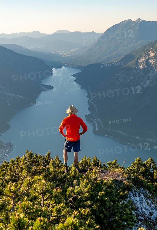 Young man looking over mountain landscape