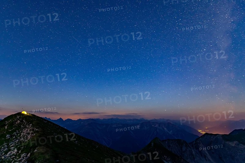 Starry sky summit of Kreuzspitze and tent