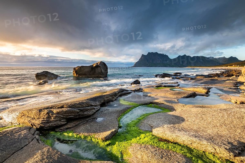 Rocks on the beach of Uttakleiv at evening light