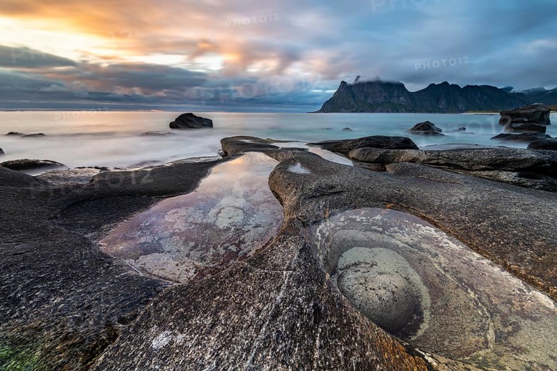 Rocks on the beach of Uttakleiv at evening light