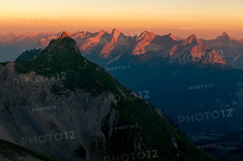 Summit of the Pfeilspitze in the foreground and Hornbachkette in the background at sunrise
