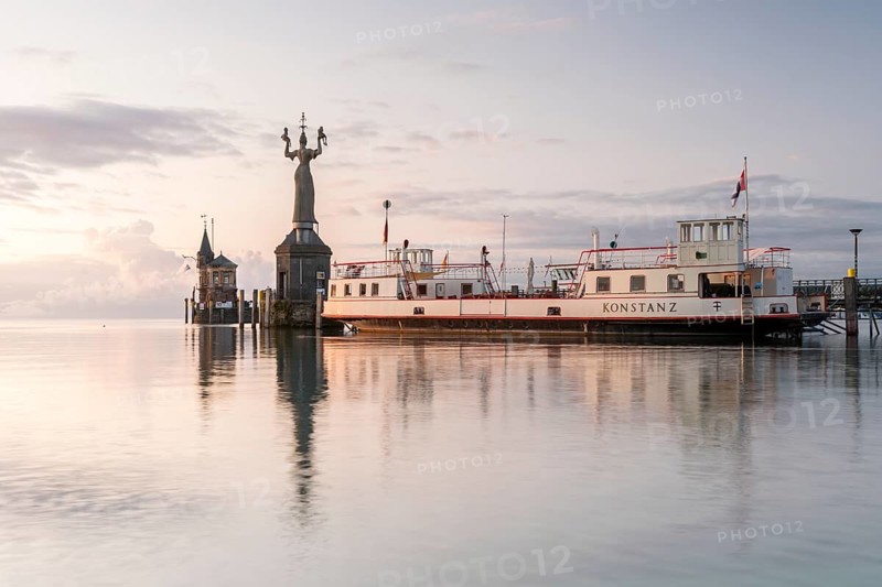 Sunrise with the old ferry Konstanz with Imperia in the harbour of Konstanz
