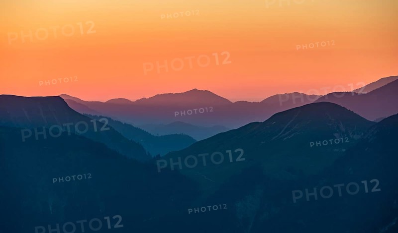 Sunset behind mountain silhouette