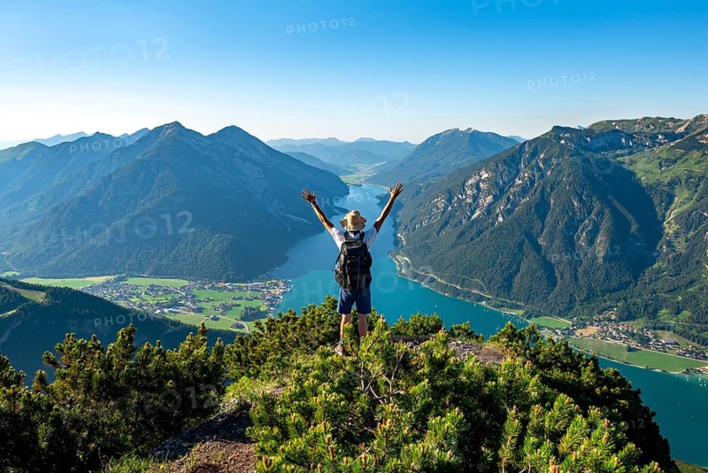 Hiker stretches arms in the air