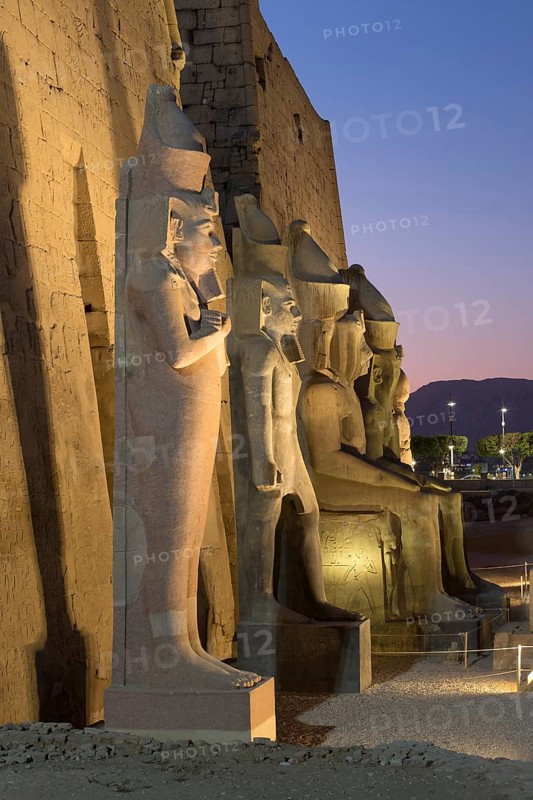 Temple of Luxor at dusk with colossal statues of Ramses ll