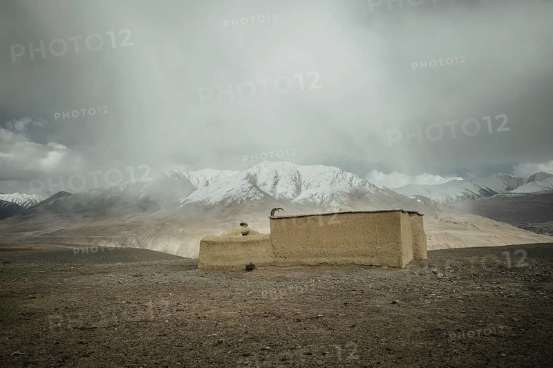 Clay mosque decorated with the horns of an ibex