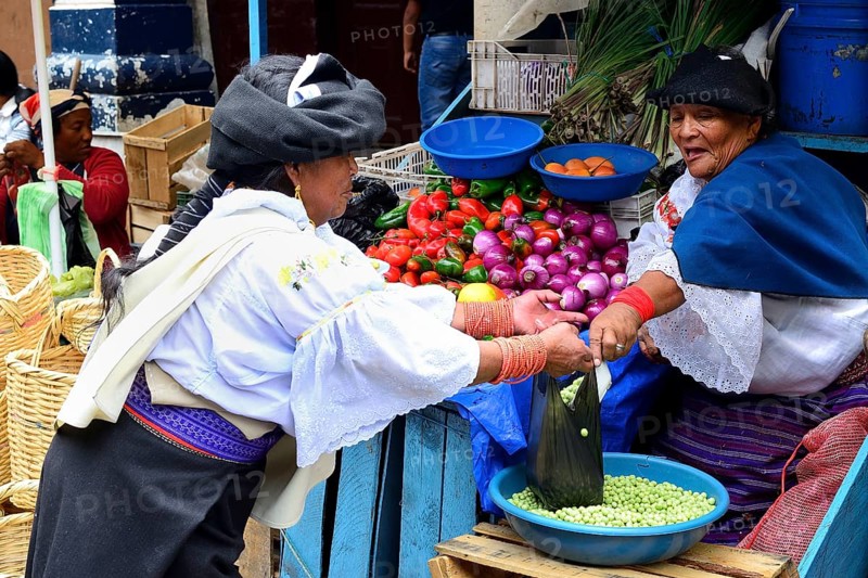 Indigenous woman selling vegetables at the market