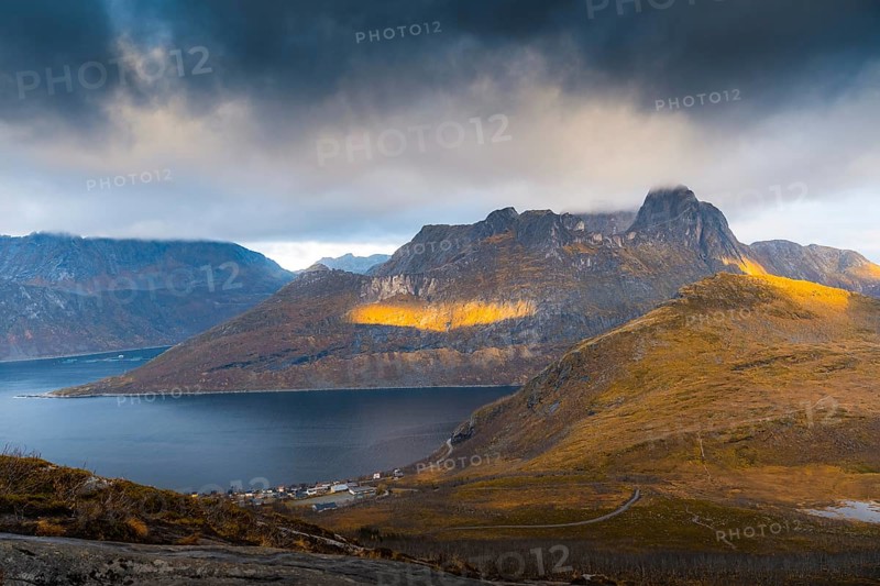 View of the village of Fjordbotn and a prominent and pointed mountain