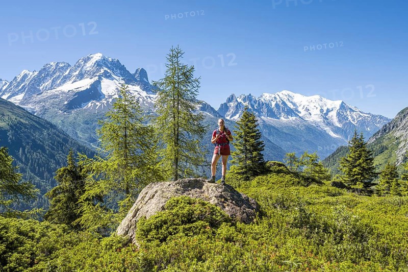 Hiker Looking at mountain panorama from Aiguillette des Posettes