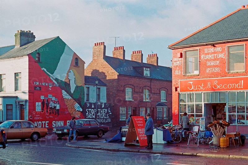 Street scene with car traffic and shops