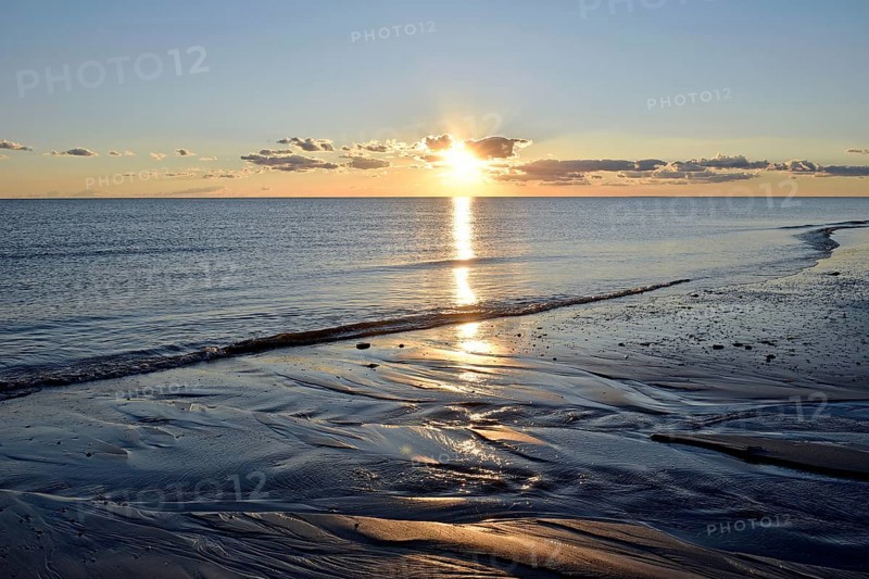 Sunset at the sandy beach Nebel