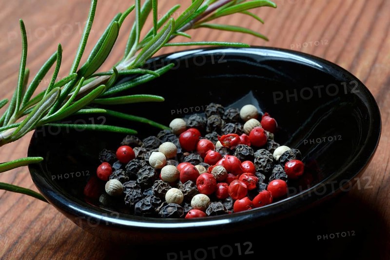 Black and white peppercorns in shell