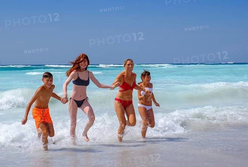 Family in the water bathing