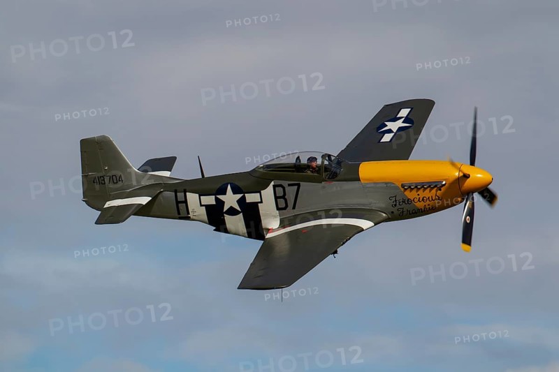 North American Aviation P-51 Mustang aircraft in flight in United States Airforce markings