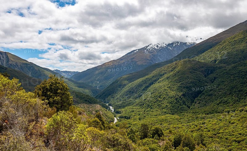View of mountains and forest with Haast River