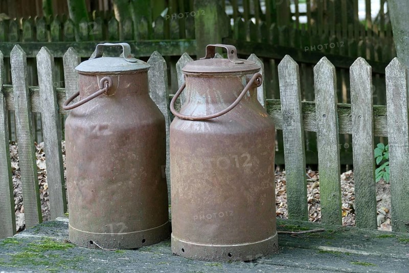 Rusty old iron milk cans