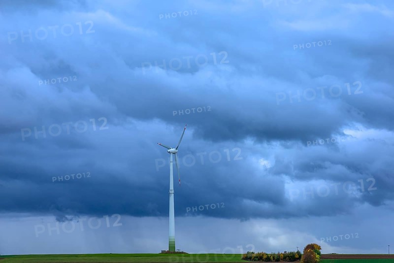Windmill with rain clouds