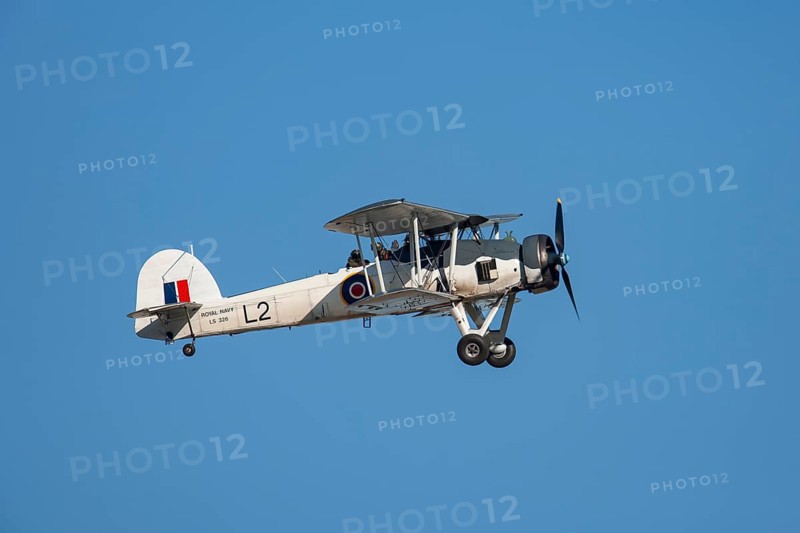 Fairey Swordfish aircraft in flight in Royal Navy markings