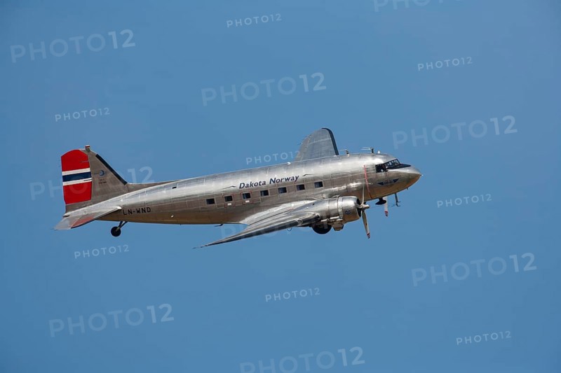 Douglas DC-3 Dakota aircraft in flight in Norway markings